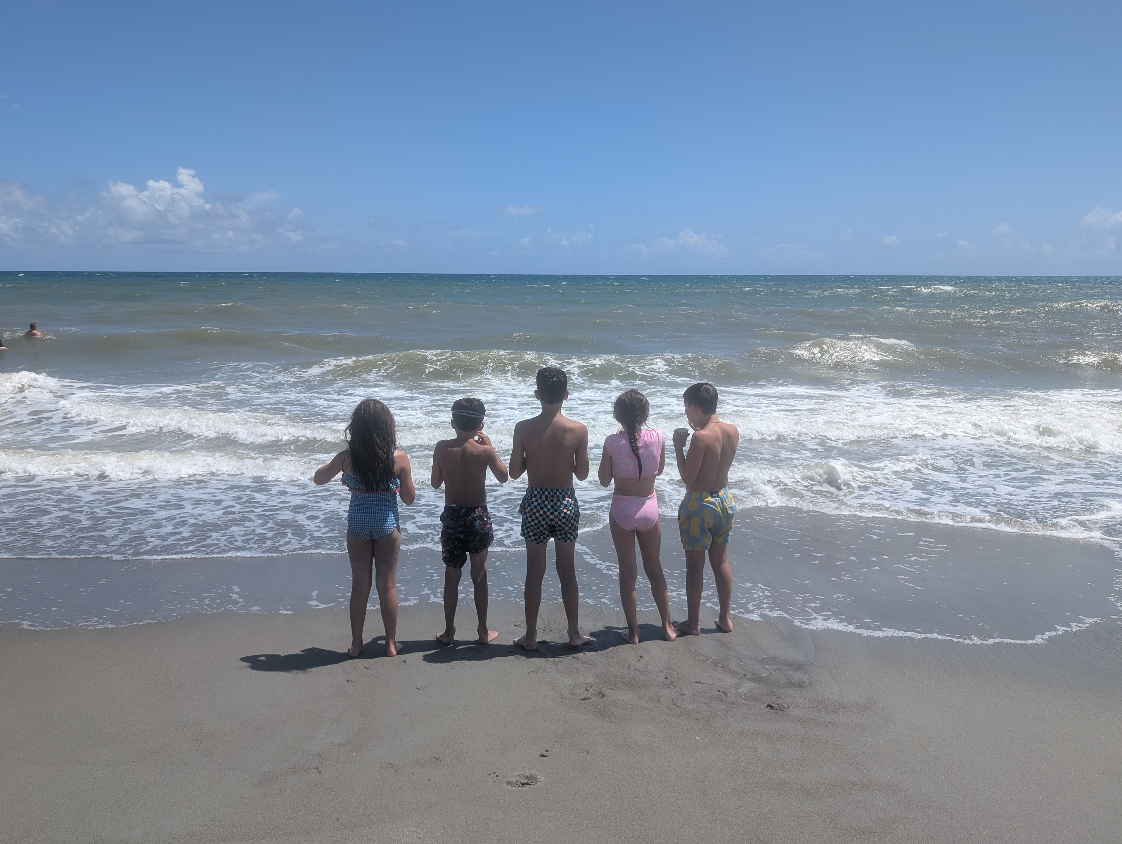 Group of friends on a trip coordinating gear and splitting expenses